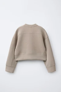 RAISED TEXT SWEATSHIRT