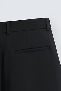 RELAXED FIT PLEATED PANTS