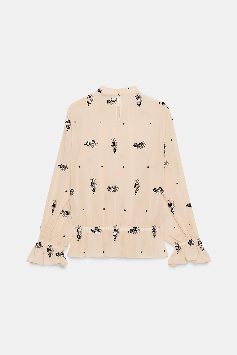 BLOUSE SEMI-TRANSPARENTE À PAILLETTES