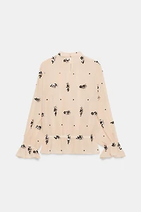 BLOUSE SEMI-TRANSPARENTE À PAILLETTES