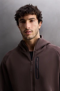 SWEAT TECHNIQUE À CAPUCHE ZIPPÉ