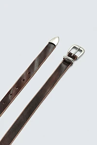 CEINTURE EN CUIR AVEC BOUT MÉTALLIQUE