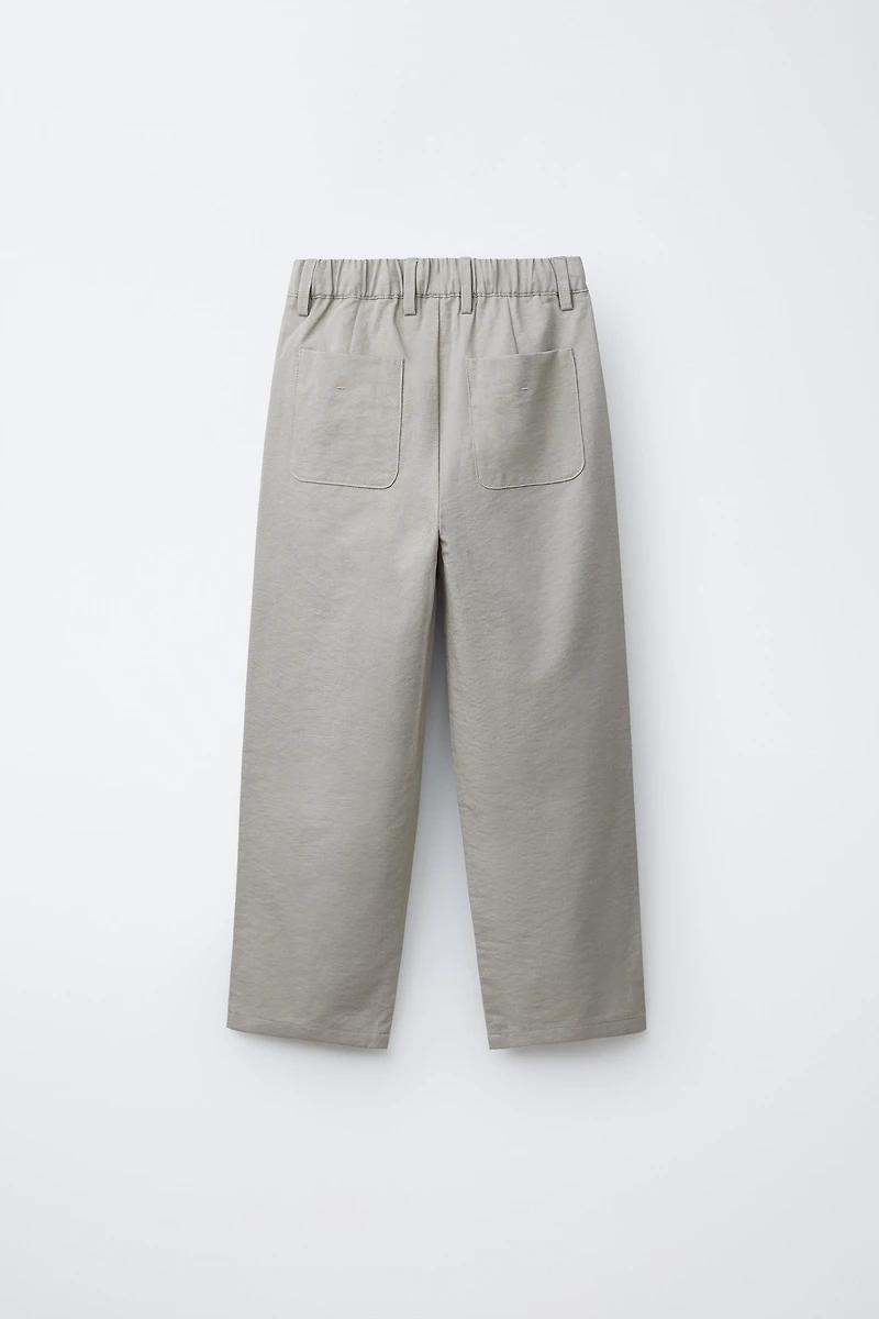 FLOWY PLEATED PANTS