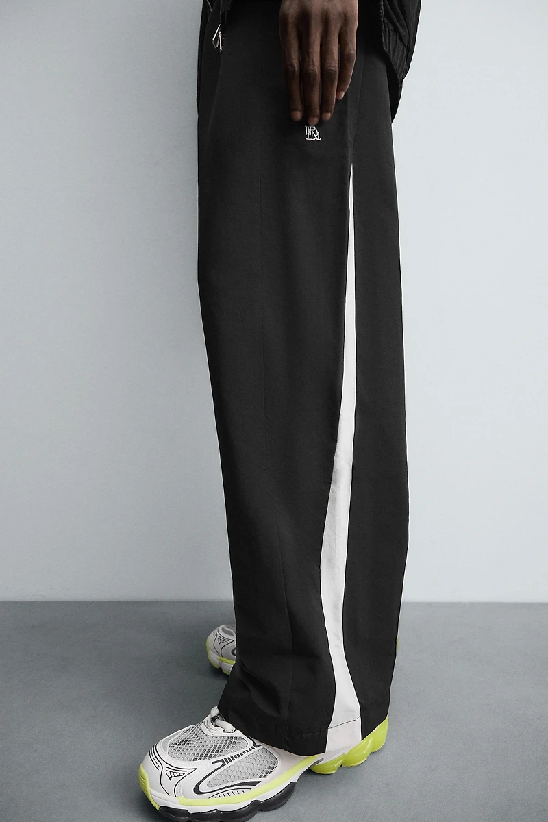 TECHNICAL PANTS WITH STRIPES