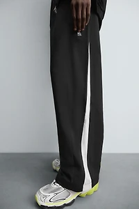 TECHNICAL PANTS WITH STRIPES