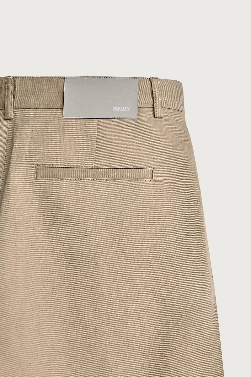 RELAXED FIT PLEATED PANTS
