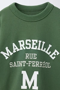 RAISED TEXT SWEATSHIRT