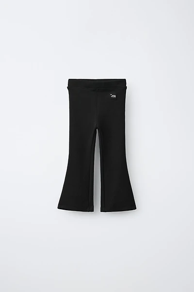 LABEL DETAIL INTERLOCK FLARE LEGGINGS