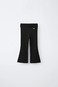 LABEL DETAIL INTERLOCK FLARE LEGGINGS