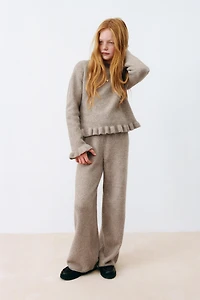 PULL EN MAILLE À VOLANTS