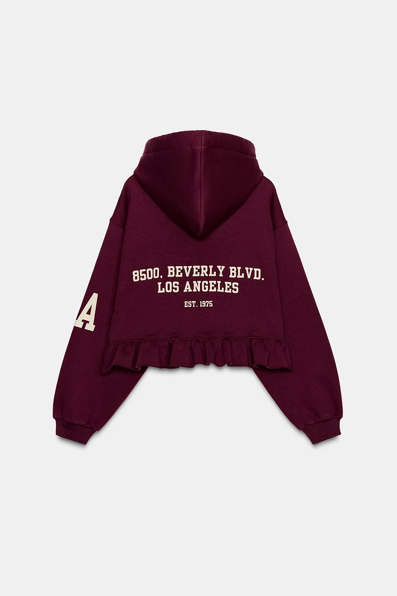 RUFFLED VARSITY SWEATSHIRT