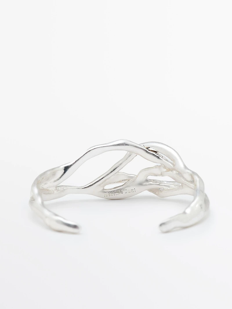 Bracelet métallique abstrait