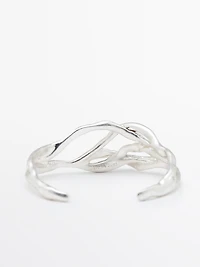 Bracelet métallique abstrait