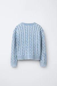 PULL EN MAILLE À TORSADES DÉLAVÉ