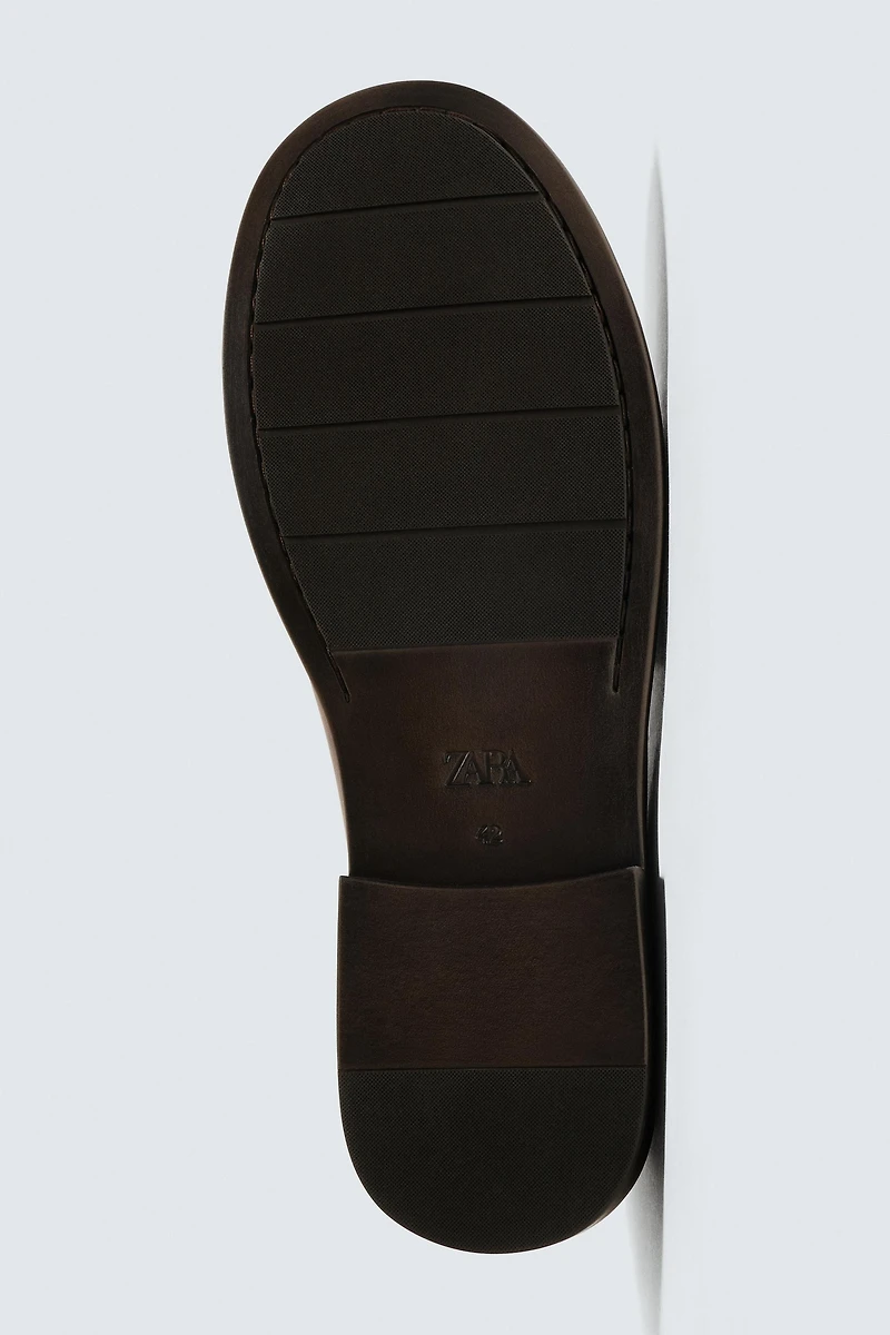 MOCASSINS EN CUIR À MASQUE