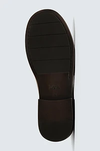 MOCASSINS EN CUIR À MASQUE
