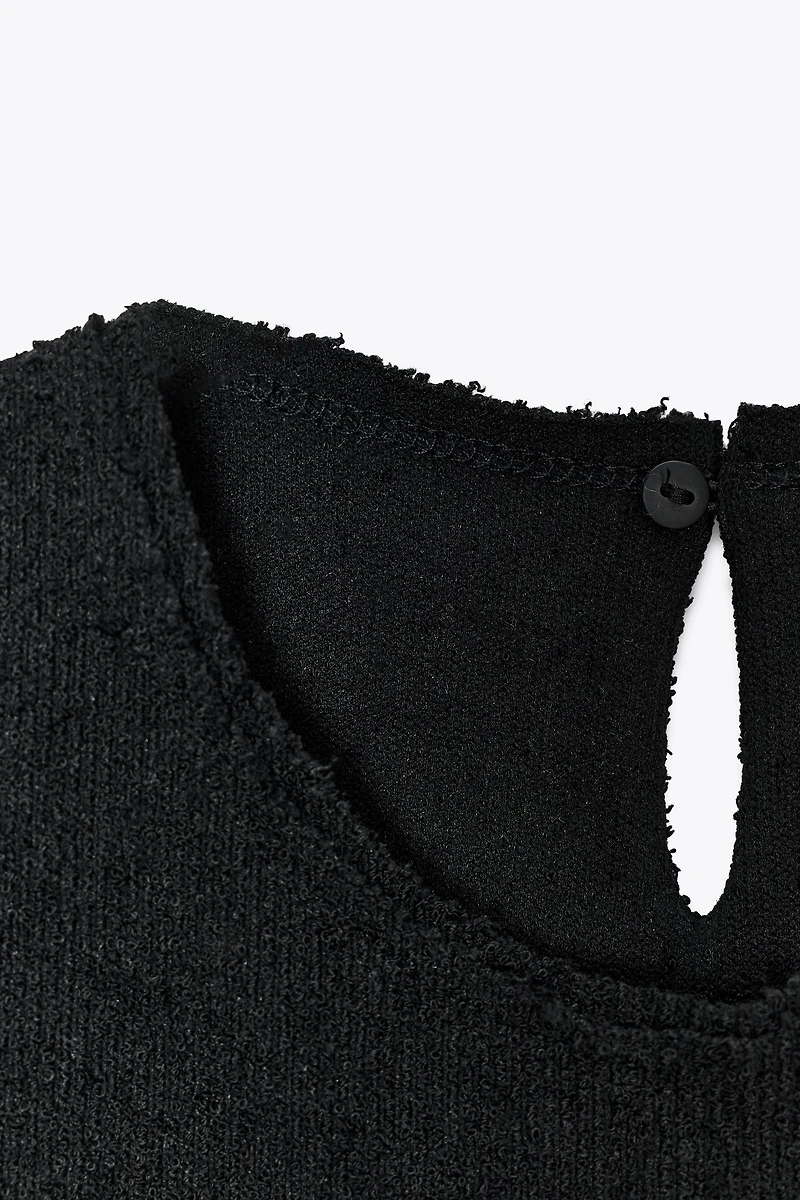 BOUCLÉ BUCKLE PEPLUM TOP