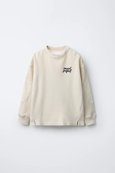 WAFFLE TEXT ELBOW PATCH SWEATSHIRT
