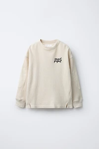 WAFFLE TEXT ELBOW PATCH SWEATSHIRT