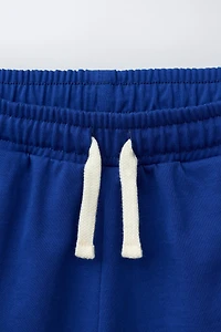 PLUSH SHORTS WITH CONTRAST PIPING