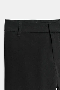 PANTALON FLARE À PASSANTS