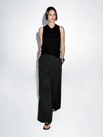 Sleeveless top with draped neckline