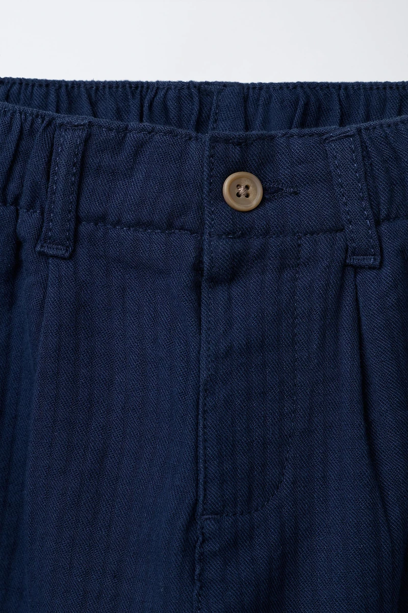 TEXTURED PANTS WITH LABEL