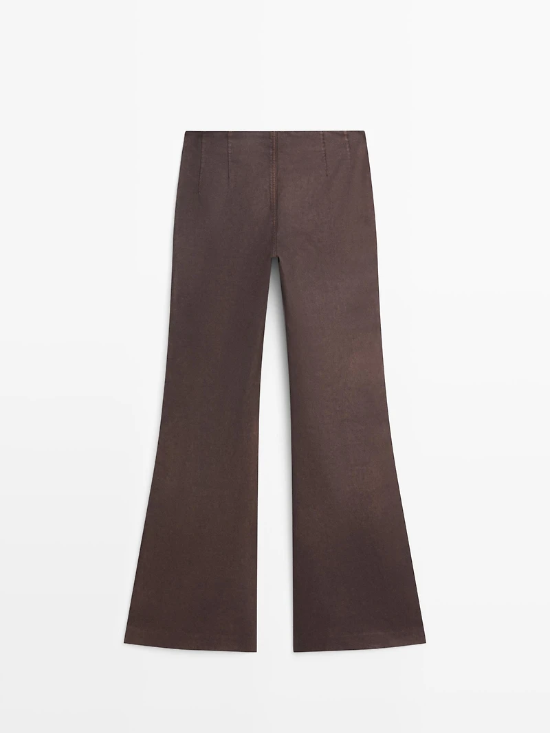 Waxed flare fit trousers