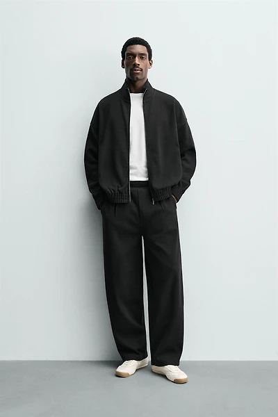 PLEATED WIDE FIT JOGGER PANTS