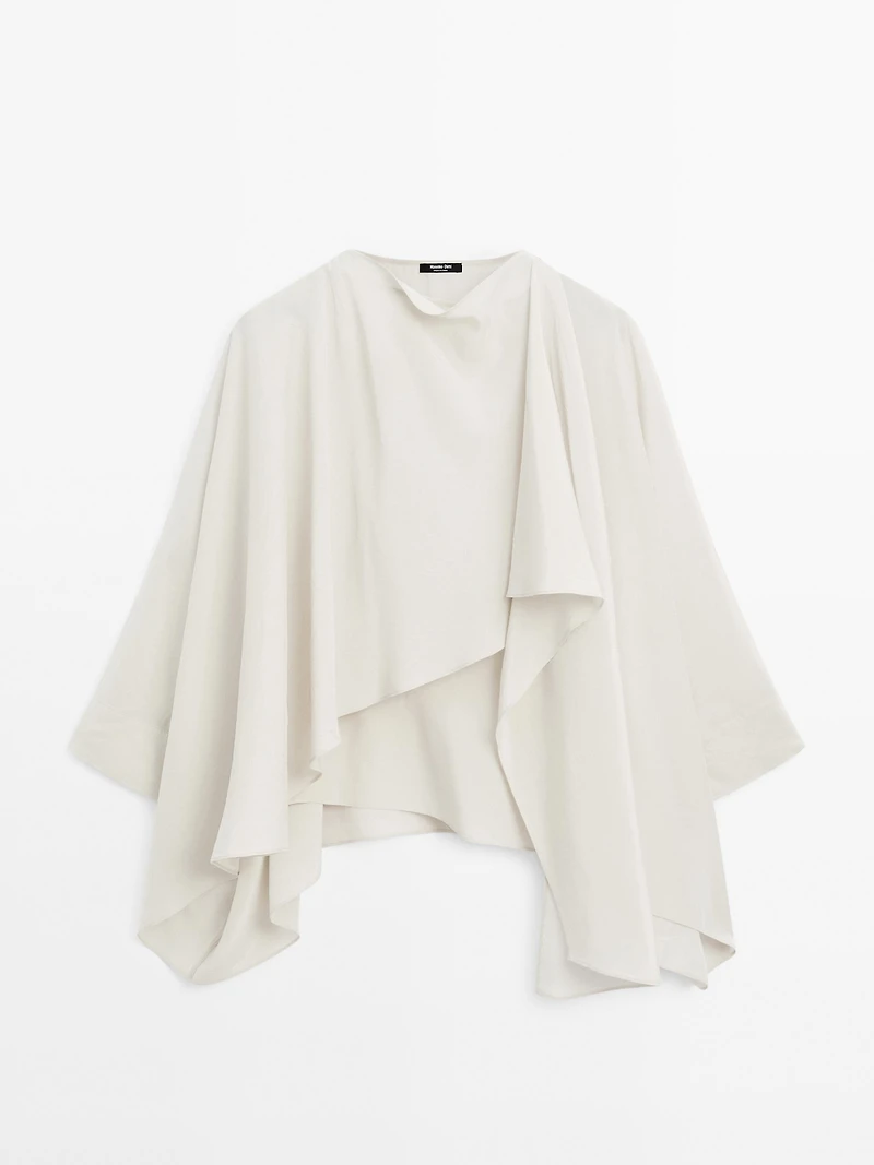 Short flowing cape with sleeve detail