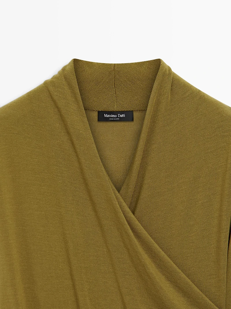Draped top with surplice neckline