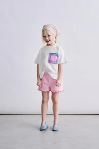 T-SHIRT POCHE ONDULÉE