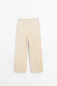 Flowing trousers with pleats