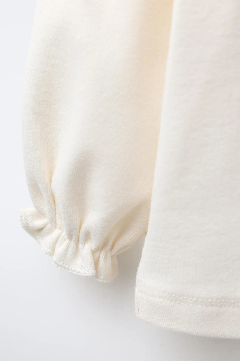 HAUT CHAUD À COL BRODÉ