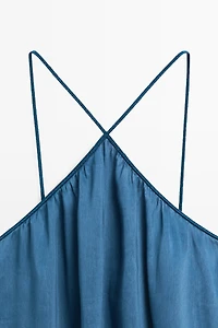 Long flowing dress with criss-cross straps