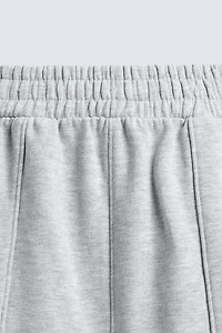 PANTALON DE JOGGING COUPE BALLON AVEC PIÈCE