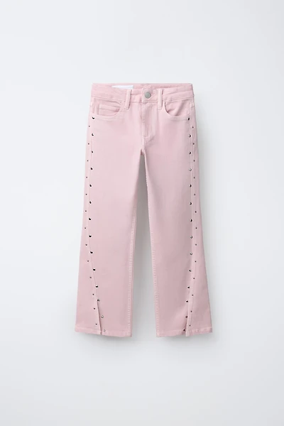 JEANS BOOTCUT À CLOUS ET OUVERTURES
