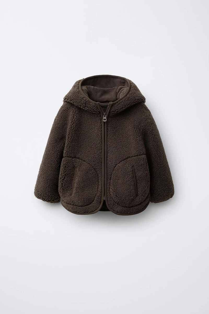 VESTE EFFET MOUTON À CAPUCHE