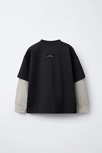 VARSITY INTERLOCK DOUBLE SLEEVE SWEATSHIRT