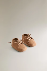 CHAUSSON BOTTE LACETS CUIR
