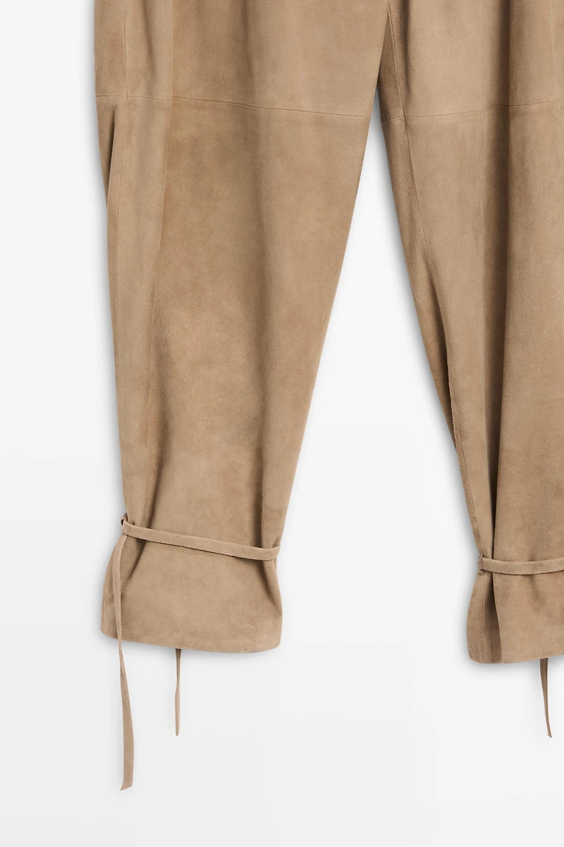 Suede leather pants with tie-detail hems
