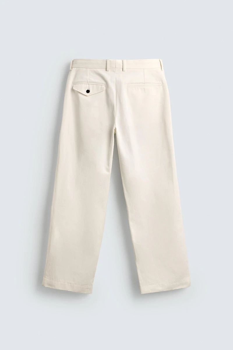 PANTALON CHINO À PLIS AARON LEVINE X ZARA