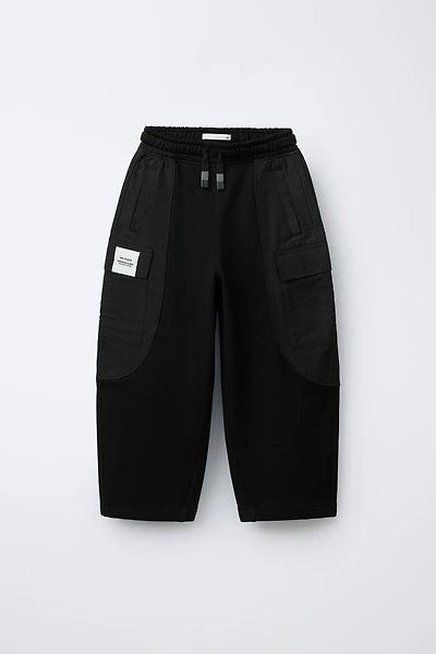 COMBINATION PANTS WITH LABEL