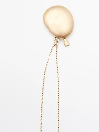 Necklace with metal pendant