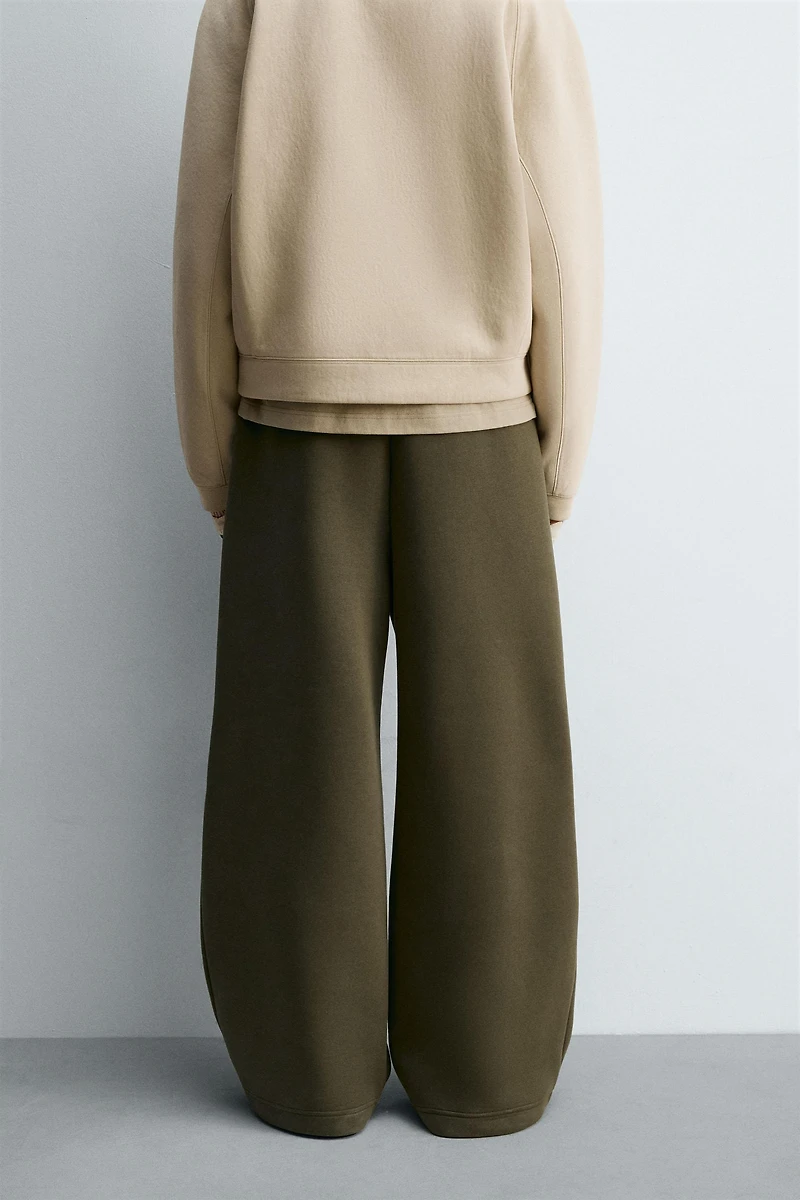 WIDE FIT NEOPRENE EFFECT PANTS WITH STUDS