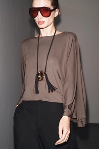 ASYMMETRIC FLOWY CAPE