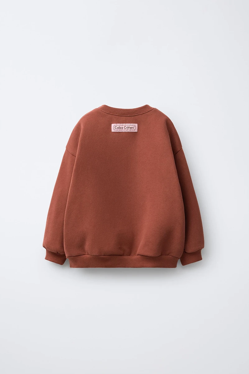 SWEAT AVEC PIÈCE CALICO CRITTERS ®