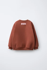 SWEAT AVEC PIÈCE CALICO CRITTERS ®