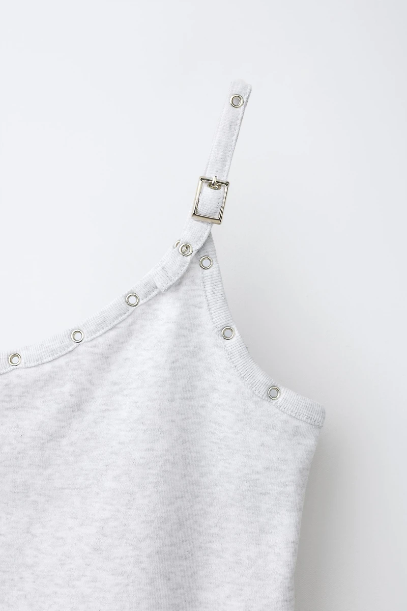 ASYMMETRIC BUCKLE TOP