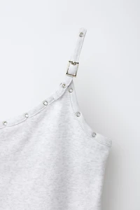 ASYMMETRIC BUCKLE TOP